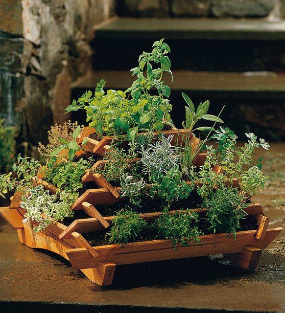 A Vertical Strawberry Or Herb Pyramid Planter