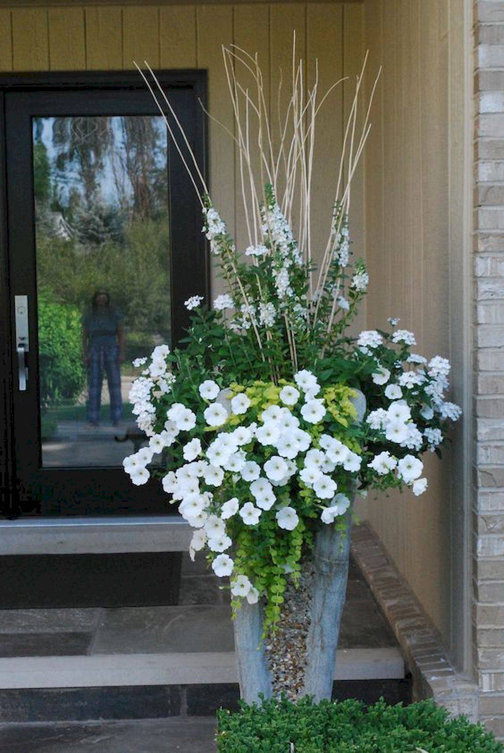 A White Container Garden Planting Flowers
