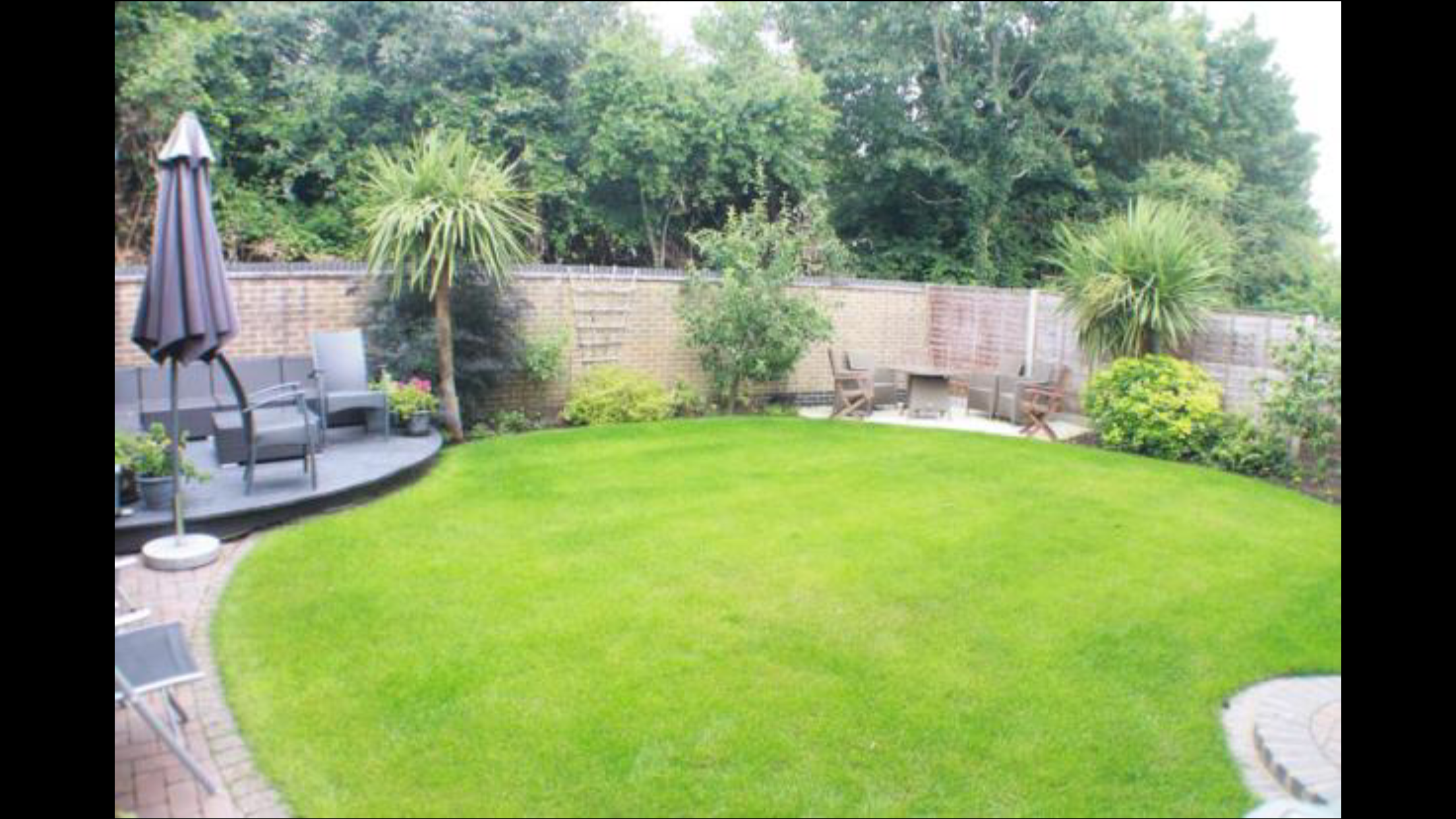 Terraced Rock Face Retaining Wall With Mini Golf Course Landscaping